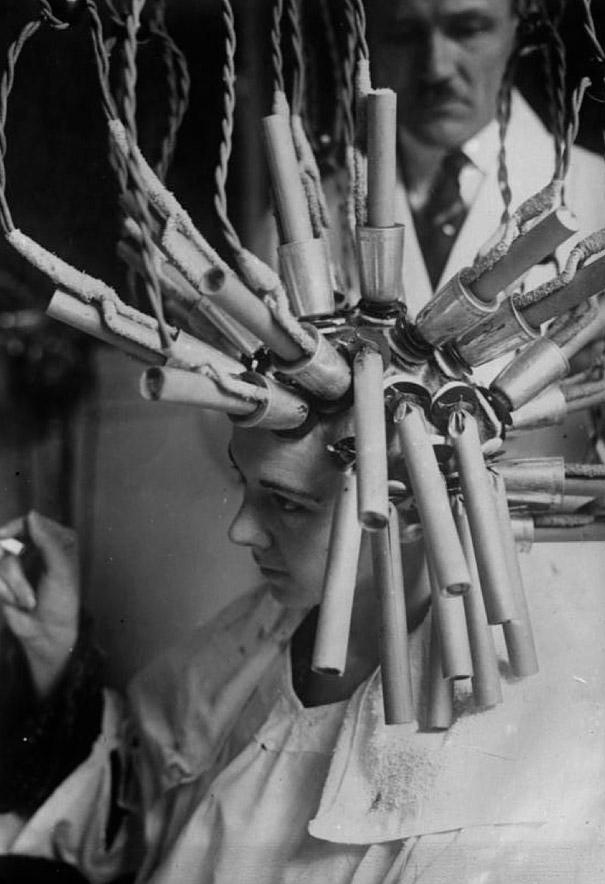 A permanent hair procedure (presumably hair waving) being performed in Germany in 1929