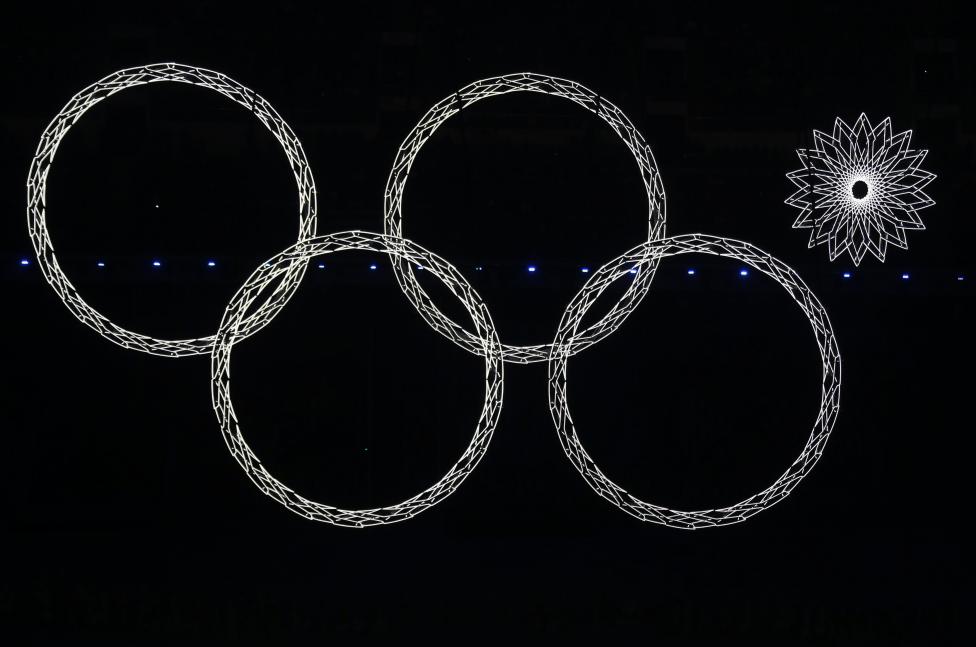 Four out of five Olympic rings are seen lit up during the opening ceremony of the 2014 Sochi Winter Olympics