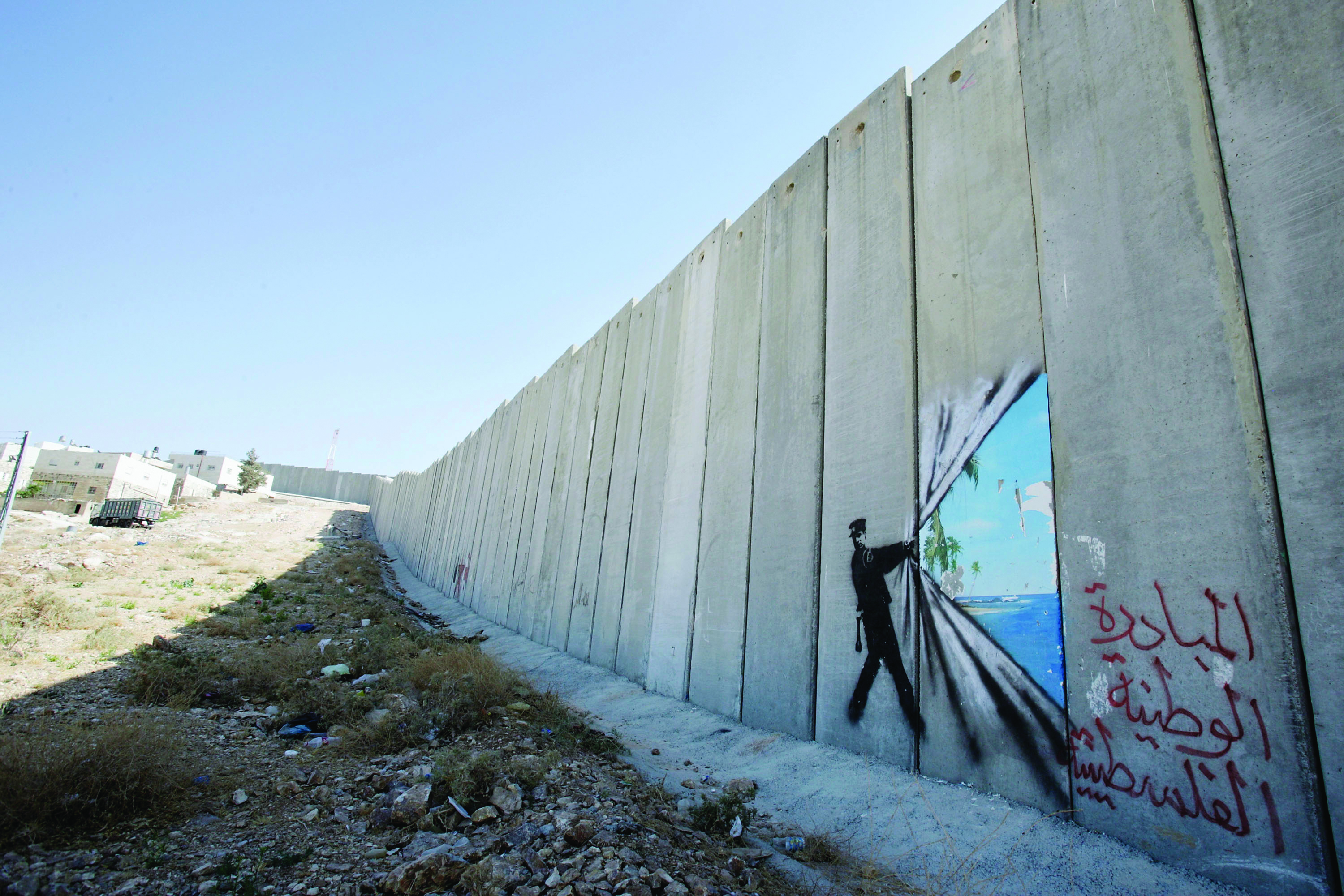 British Guerrilla Artist Decorates West Bank Barrier